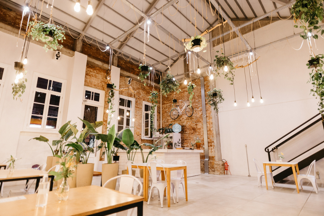 Cafe with flowers and modern furniture